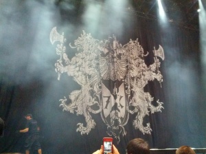 New curtain for the tour, says REV in the banner under the deathbat